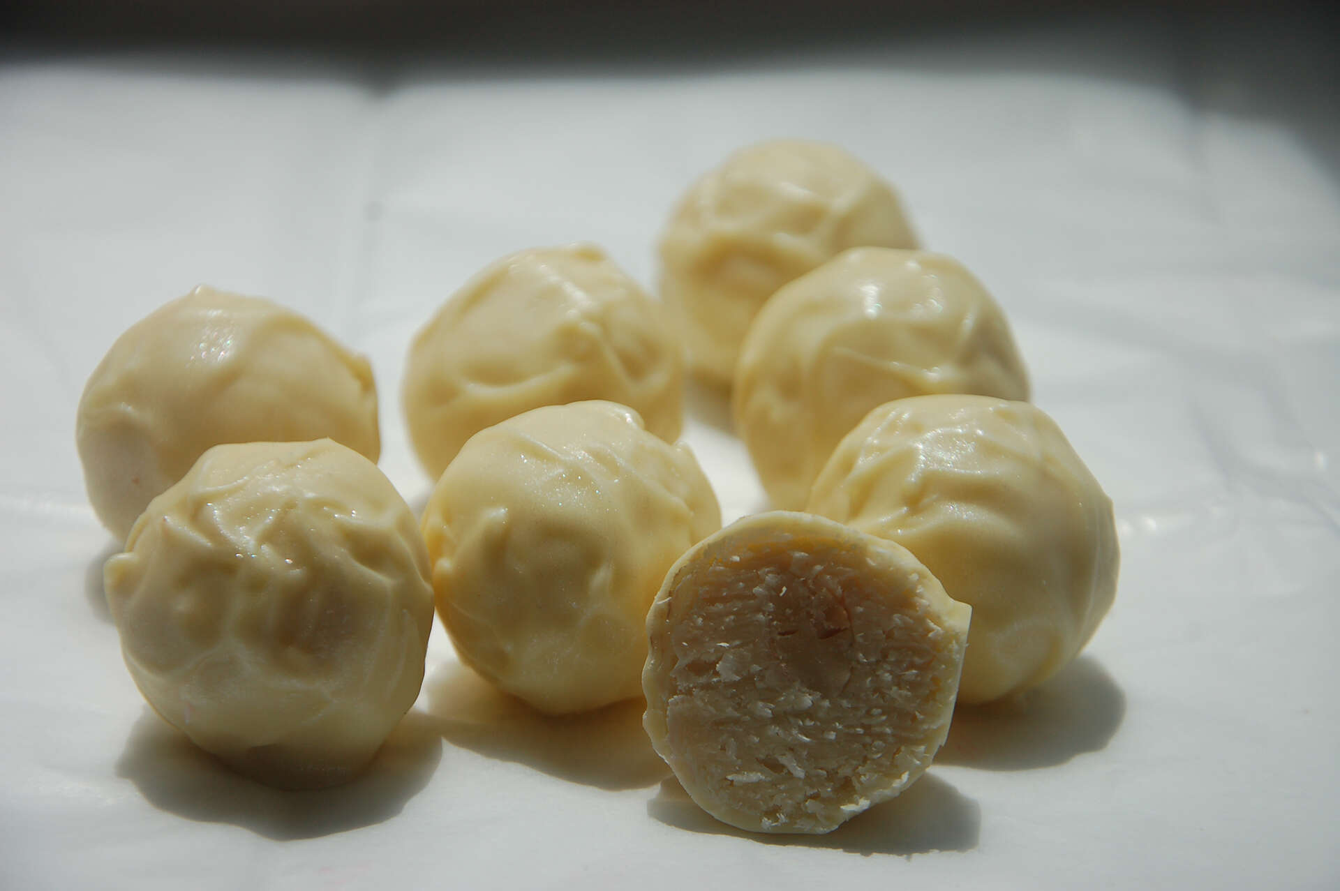 White chocolate truffle with coconut, almonds and liqueur "BAYLEIS"